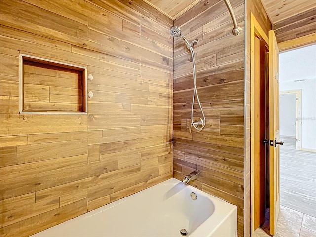 bathroom featuring wood walls, shower / washtub combination, and wooden ceiling