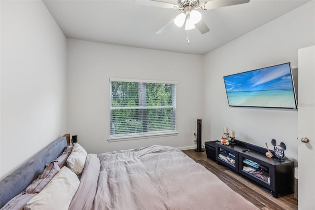 bedroom featuring ceiling fan and dark hardwood / wood-style flooring