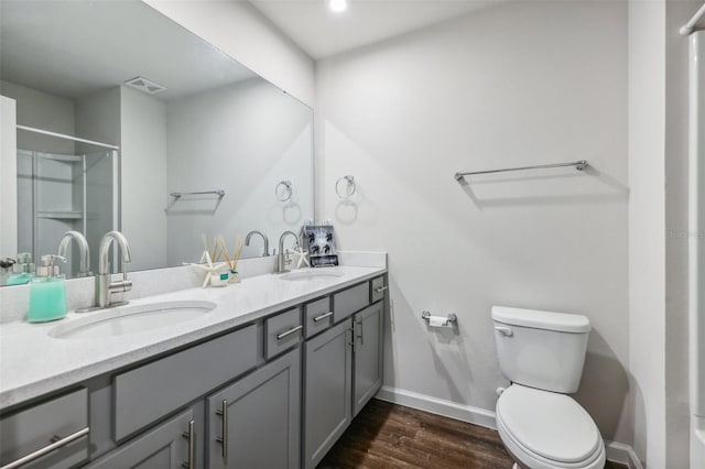 2920 Oak Park Way Apt A, Orlando, FL 32822 - bathroom with double vanity, wood finished floors, and a shower