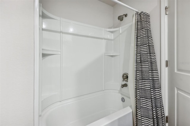 bathroom with shower / bathtub combination with curtain