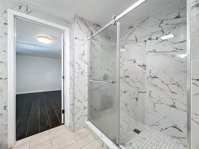 bathroom featuring an enclosed shower