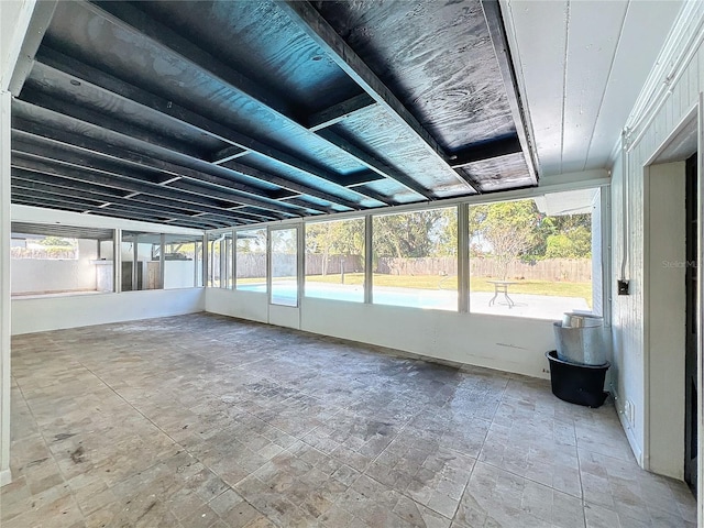 unfurnished sunroom with a healthy amount of sunlight