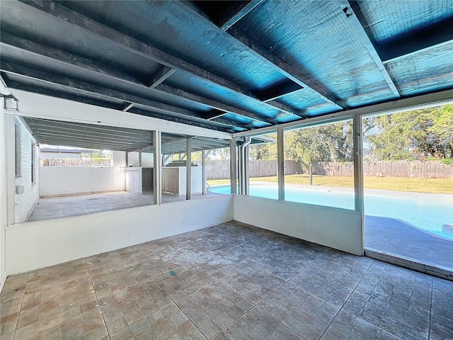 unfurnished sunroom featuring a wealth of natural light