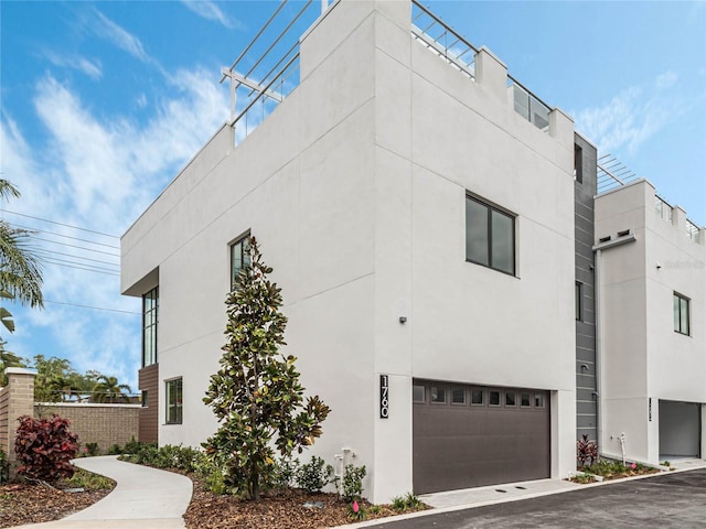 view of property exterior featuring a garage