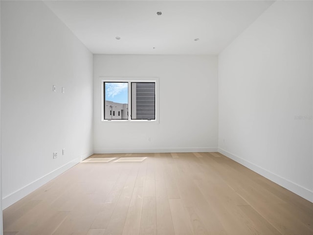 unfurnished room with light hardwood / wood-style flooring