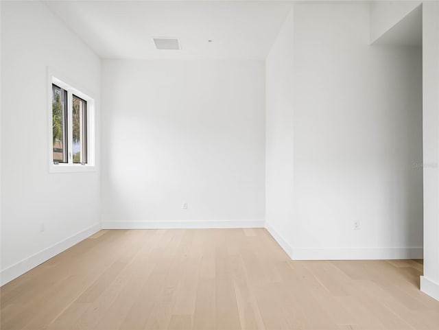 spare room with light wood-type flooring