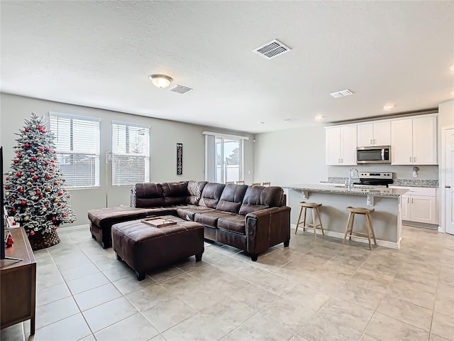 living room with light tile patterned floors