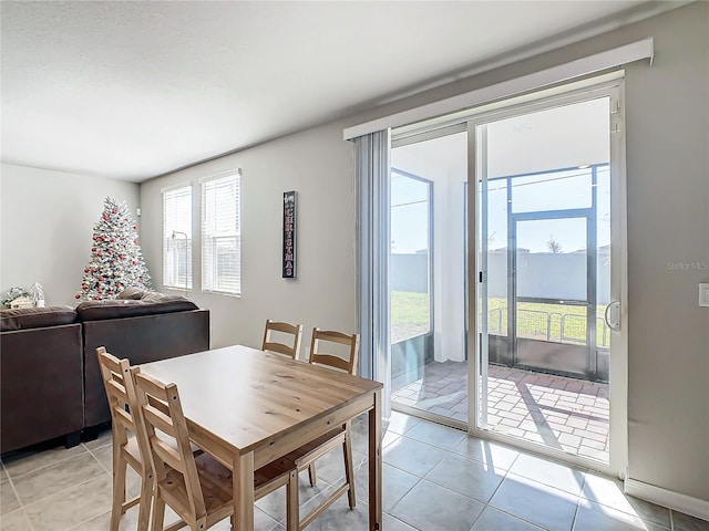 dining room with light tile patterned flooring