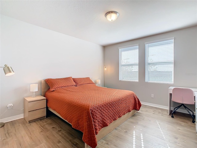 bedroom with light hardwood / wood-style flooring