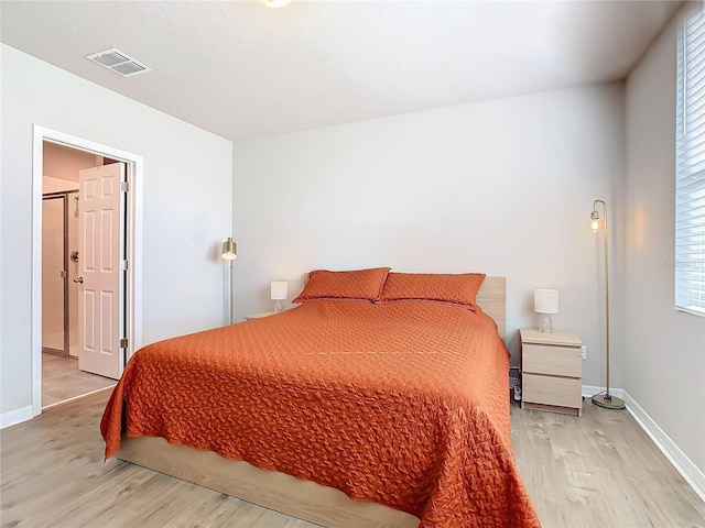 bedroom with light wood-type flooring