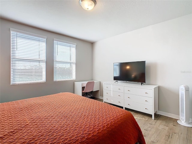 bedroom with light hardwood / wood-style floors