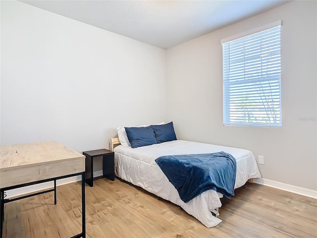 bedroom with light hardwood / wood-style flooring