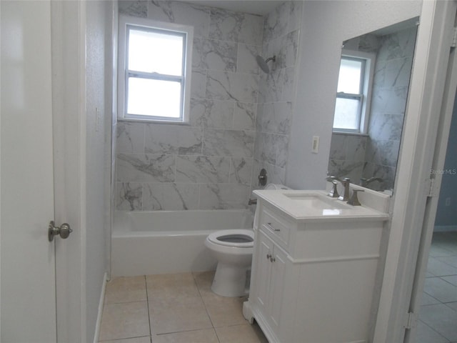 full bathroom featuring tile patterned floors, tiled shower / bath, vanity, and toilet