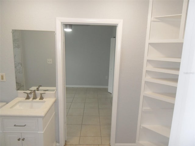 bathroom featuring tile patterned flooring and vanity