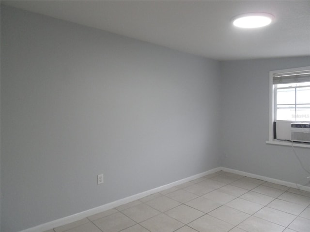 tiled spare room with vaulted ceiling and cooling unit