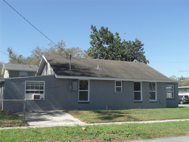 view of home's exterior featuring cooling unit and a yard