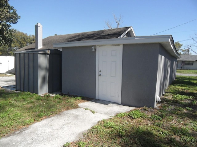 view of outdoor structure with a yard