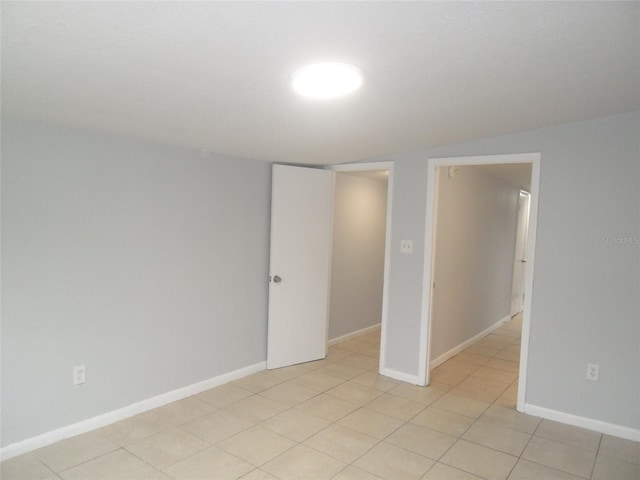 empty room featuring light tile patterned floors