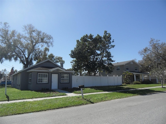 ranch-style house with a front yard