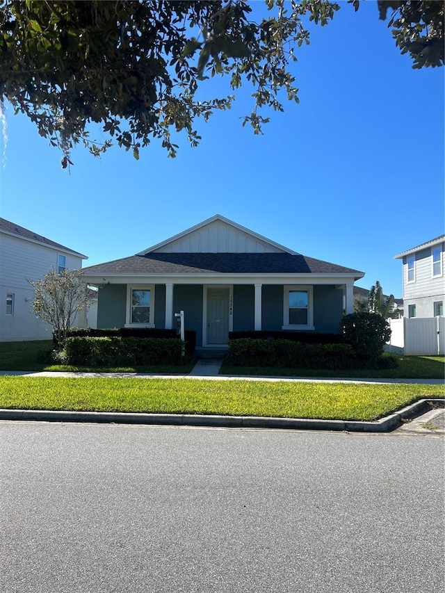 ranch-style home with a front lawn