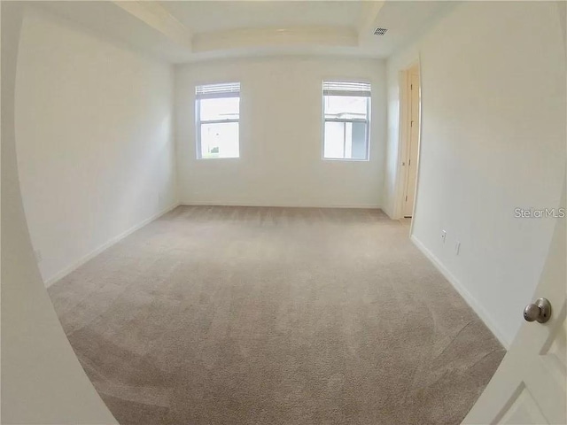 empty room featuring light carpet