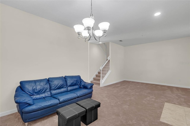 living room featuring carpet floors and an inviting chandelier