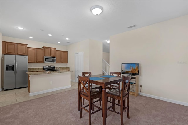 view of carpeted dining space