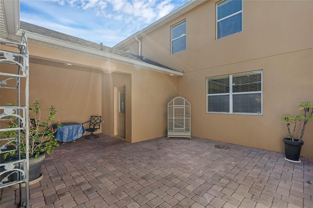 back of house with a patio