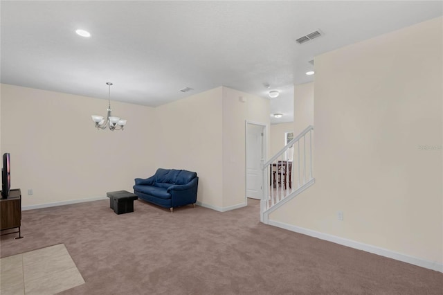 sitting room with light carpet and an inviting chandelier