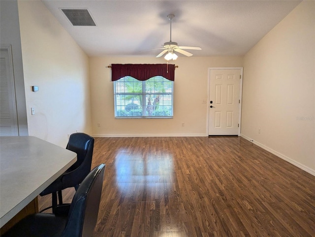 office space featuring ceiling fan and dark hardwood / wood-style flooring