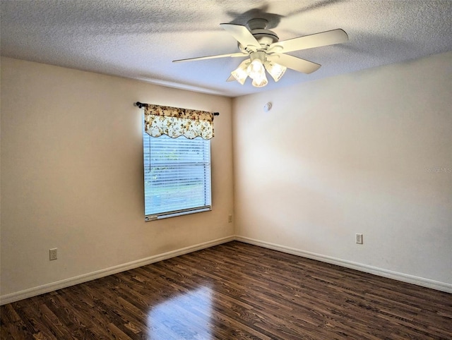 spare room featuring a textured ceiling, dark hardwood / wood-style flooring, and ceiling fan