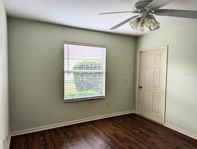 unfurnished room featuring a textured ceiling, dark hardwood / wood-style floors, and ceiling fan