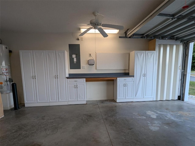 garage with electric panel, ceiling fan, and gas water heater