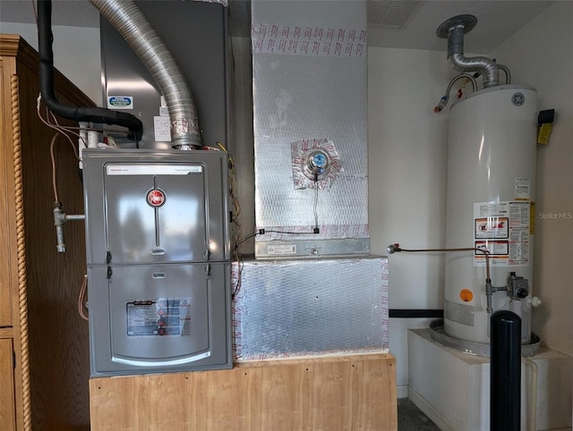 utility room featuring gas water heater