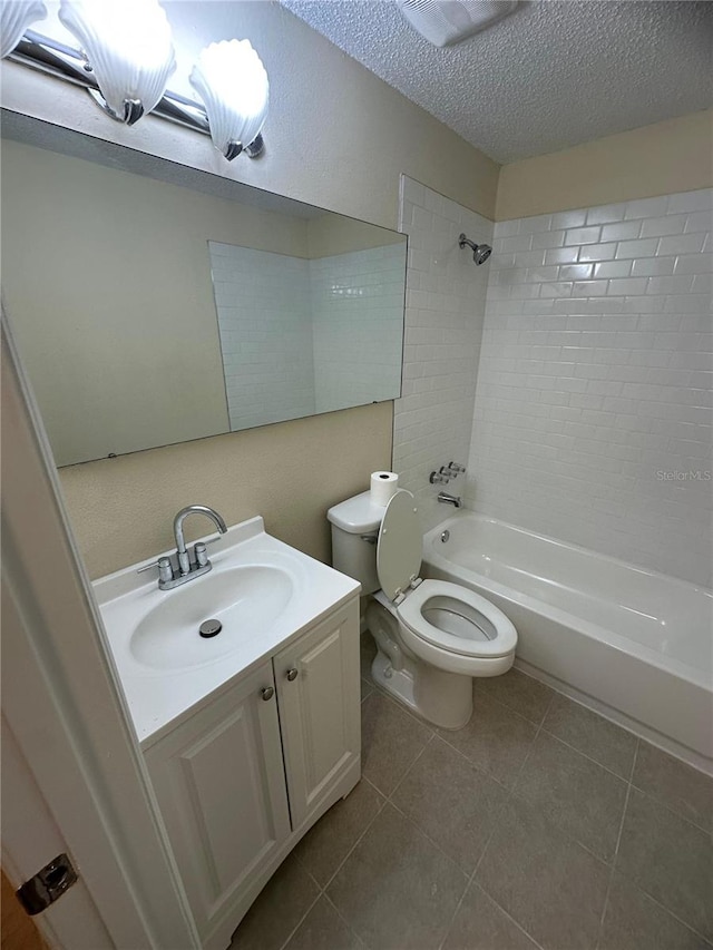 4944 Hazner St Unit 4944, New Port Richey, FL 34652 - bathroom featuring bathing tub / shower combination, vanity, a textured ceiling, and tile patterned flooring