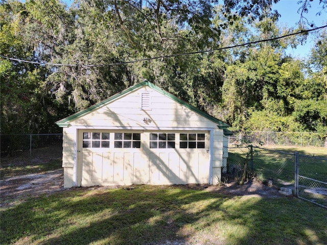 garage featuring a yard