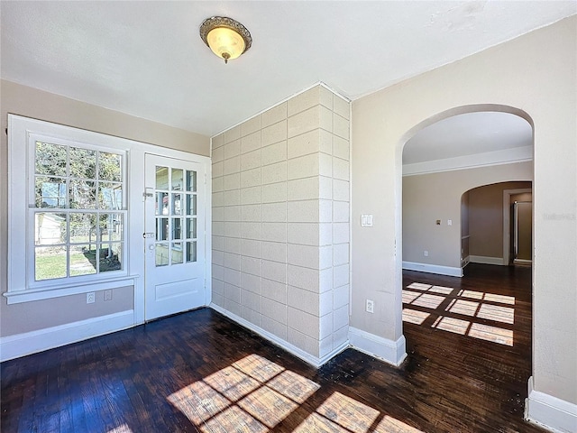 foyer with dark hardwood / wood-style floors