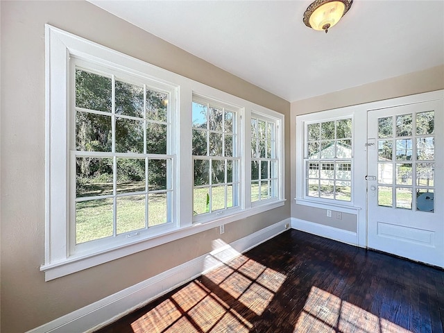 unfurnished sunroom with a wealth of natural light