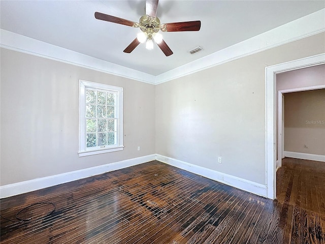 unfurnished room with ceiling fan and dark wood-type flooring