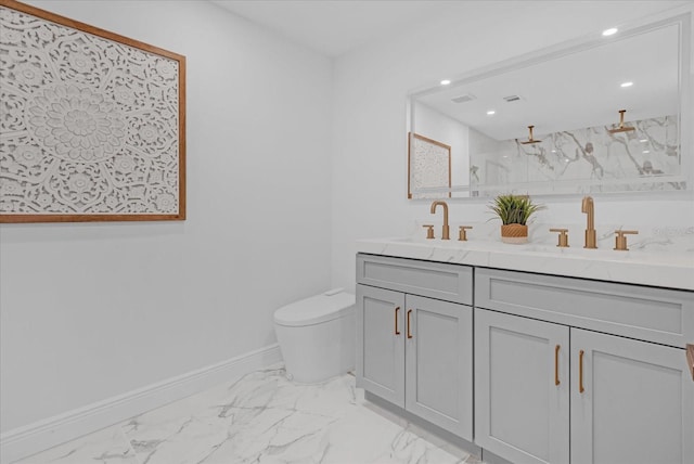 bathroom with vanity, toilet, and a shower