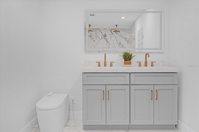 bathroom with a shower, vanity, and toilet