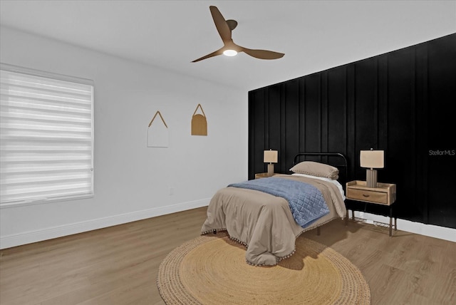 bedroom with ceiling fan and light wood-type flooring