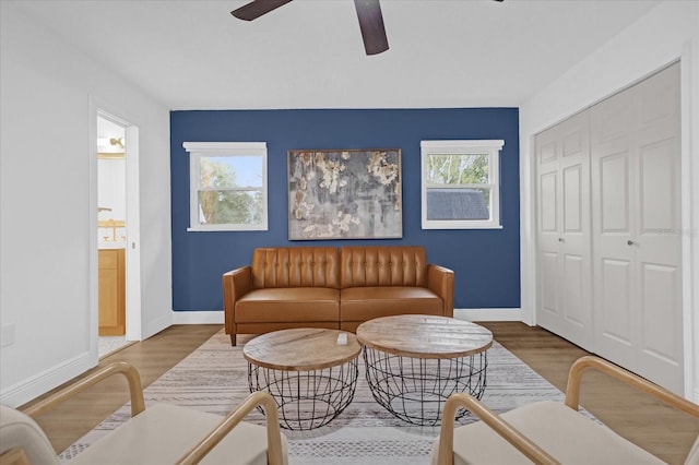 living room with hardwood / wood-style floors and ceiling fan