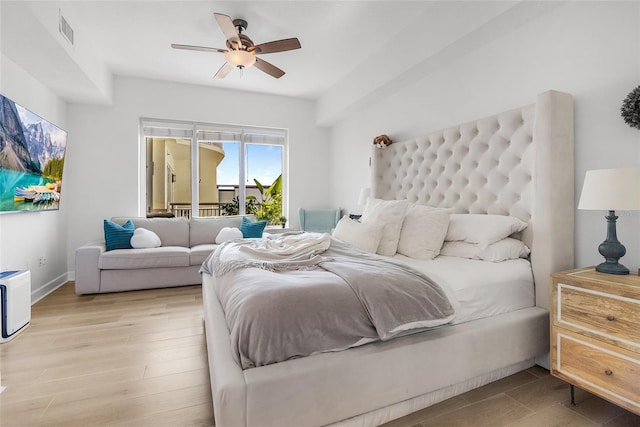 bedroom with light hardwood / wood-style floors and ceiling fan