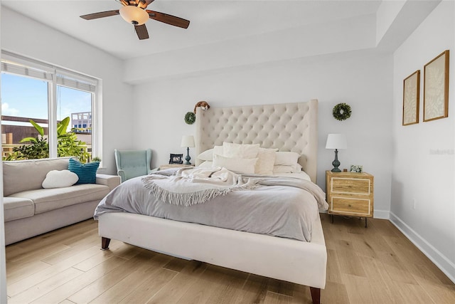 bedroom with ceiling fan and light wood-type flooring