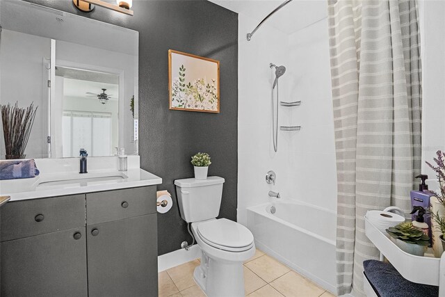 full bathroom featuring shower / bath combination with curtain, tile patterned floors, vanity, ceiling fan, and toilet