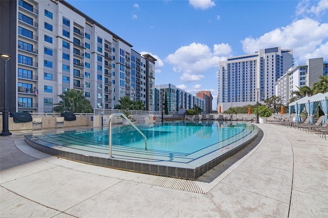 view of swimming pool featuring a patio