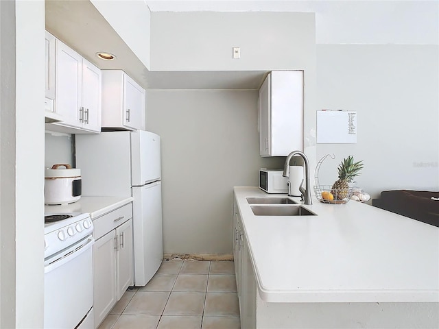 kitchen featuring white electric range oven, light tile patterned flooring, white cabinetry, and sink