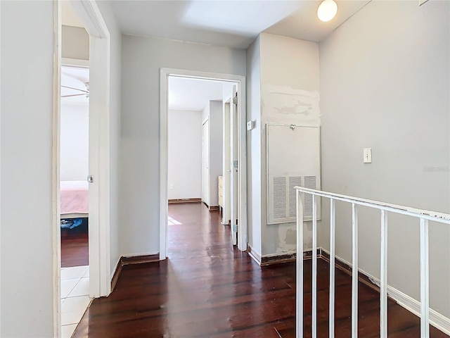 corridor featuring dark wood-type flooring