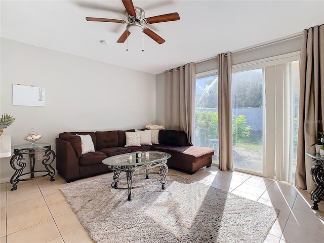 tiled living room with ceiling fan